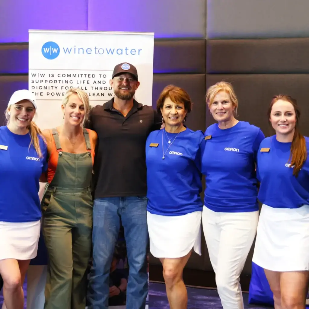 a group of people standing next to each other.