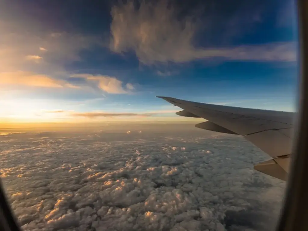 An airplane window provides a view of the wing during an incentive trip.
