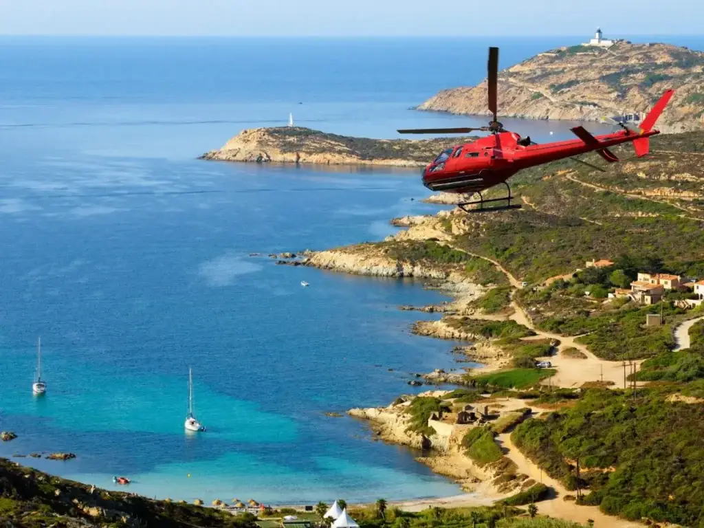 A luxurious adventure of a helicopter flying over the water.