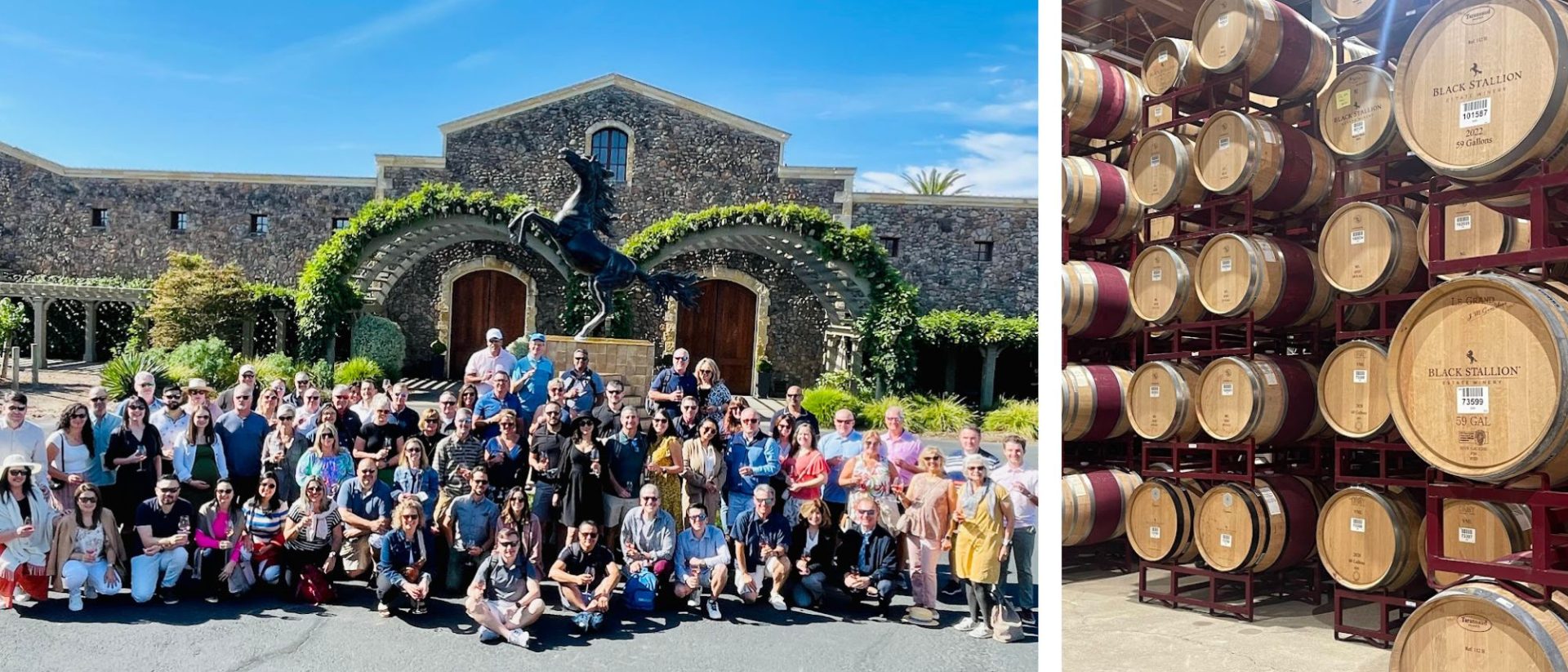 A group of people posing in front of wine barrels.